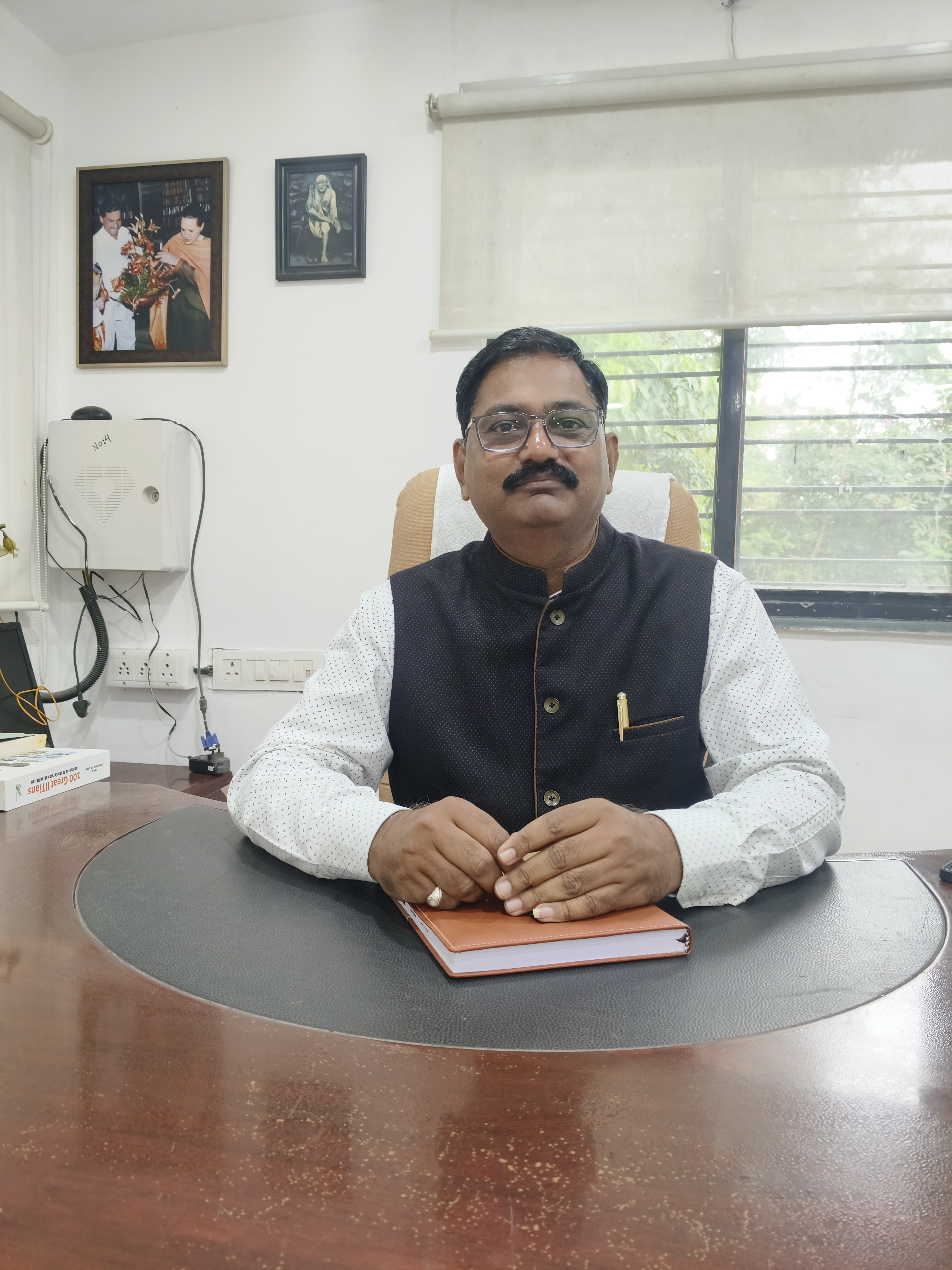 Dr. Gokul S. Talele